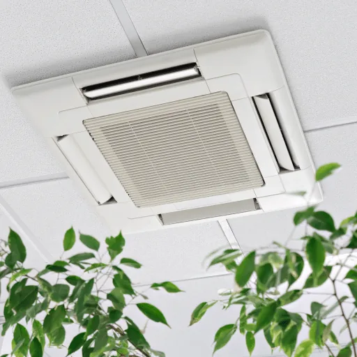 A ceiling cassette air conditioner above office plants