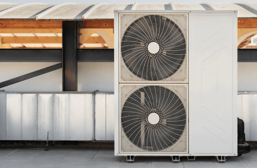 A twin-fan outdoor condenser unit serving a commercial building